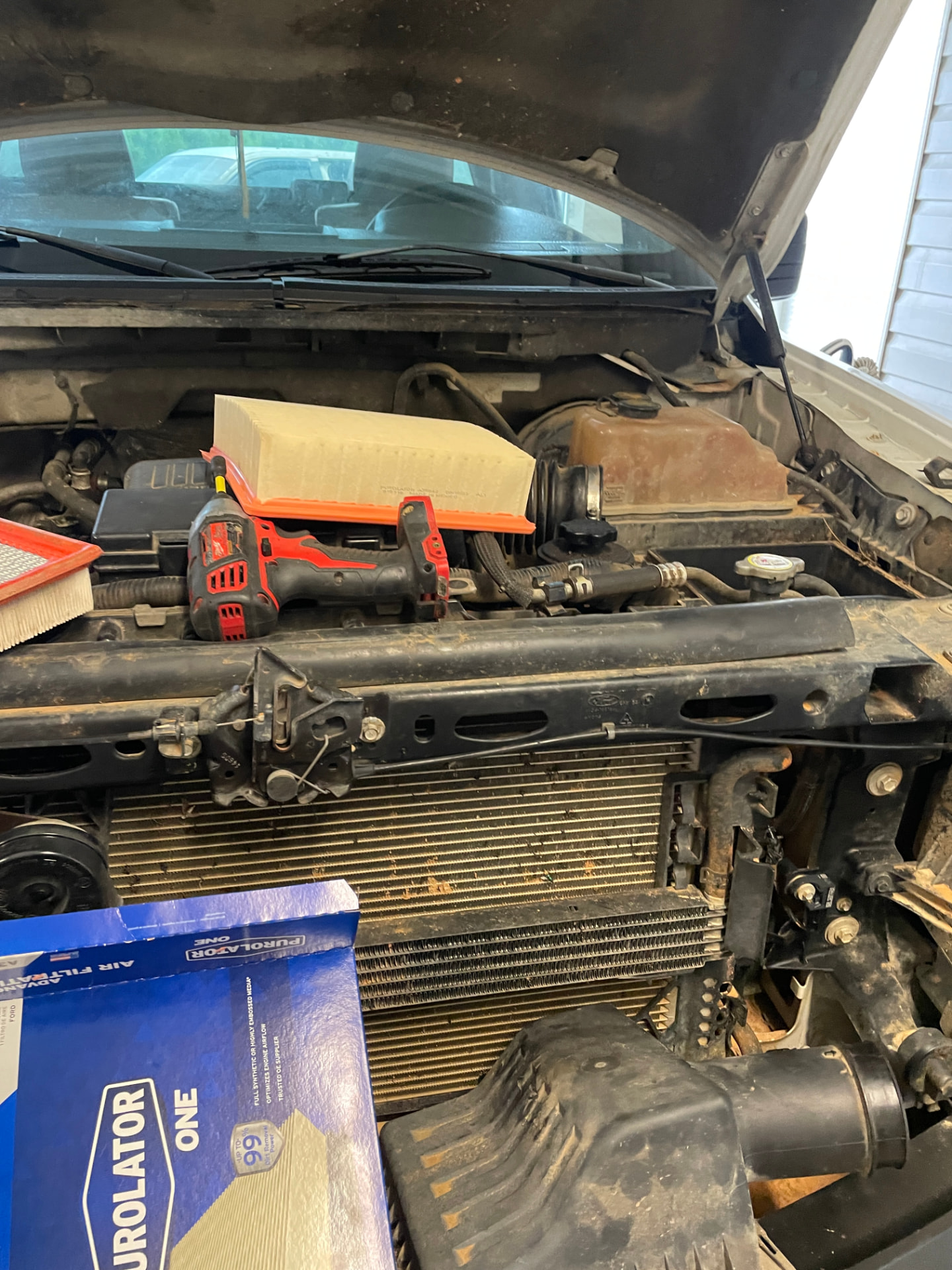 Engine air filter swap — Fresh filter, hood up, Sam's Auto mobile mechanic in Douglas, GA